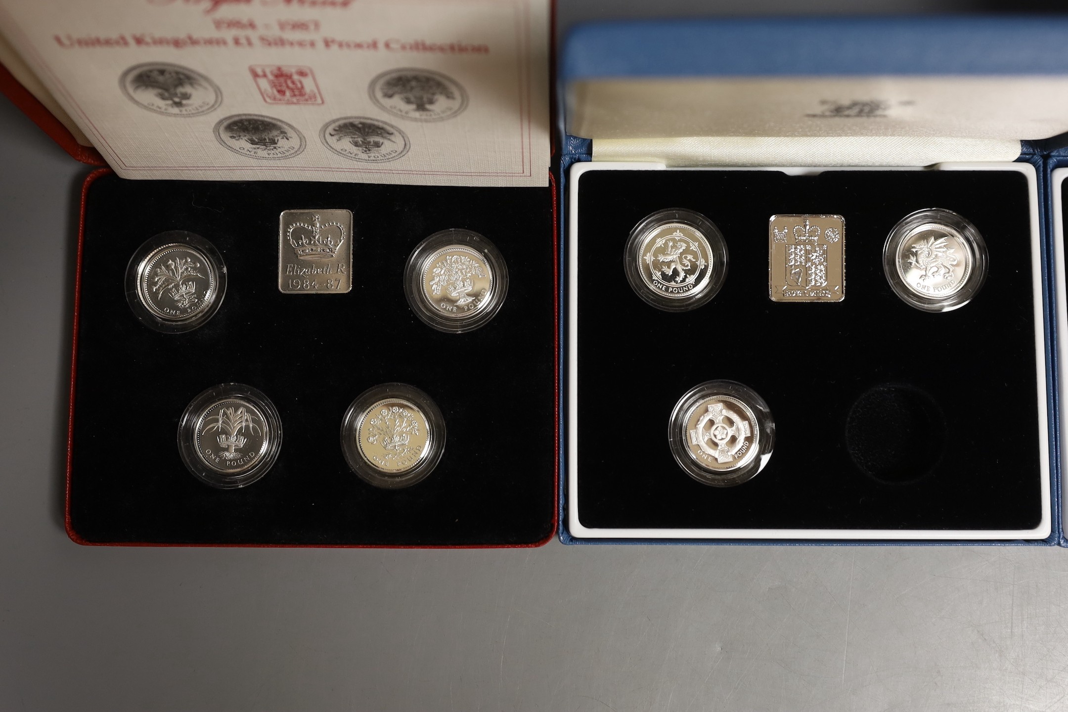 Three cased Royal Mint UK silver proof £1 coin collections 1984-87, 1994-96, 2004-07 and a 200th anniversary Nelson Trafalgar 2005 silver proof two crown set